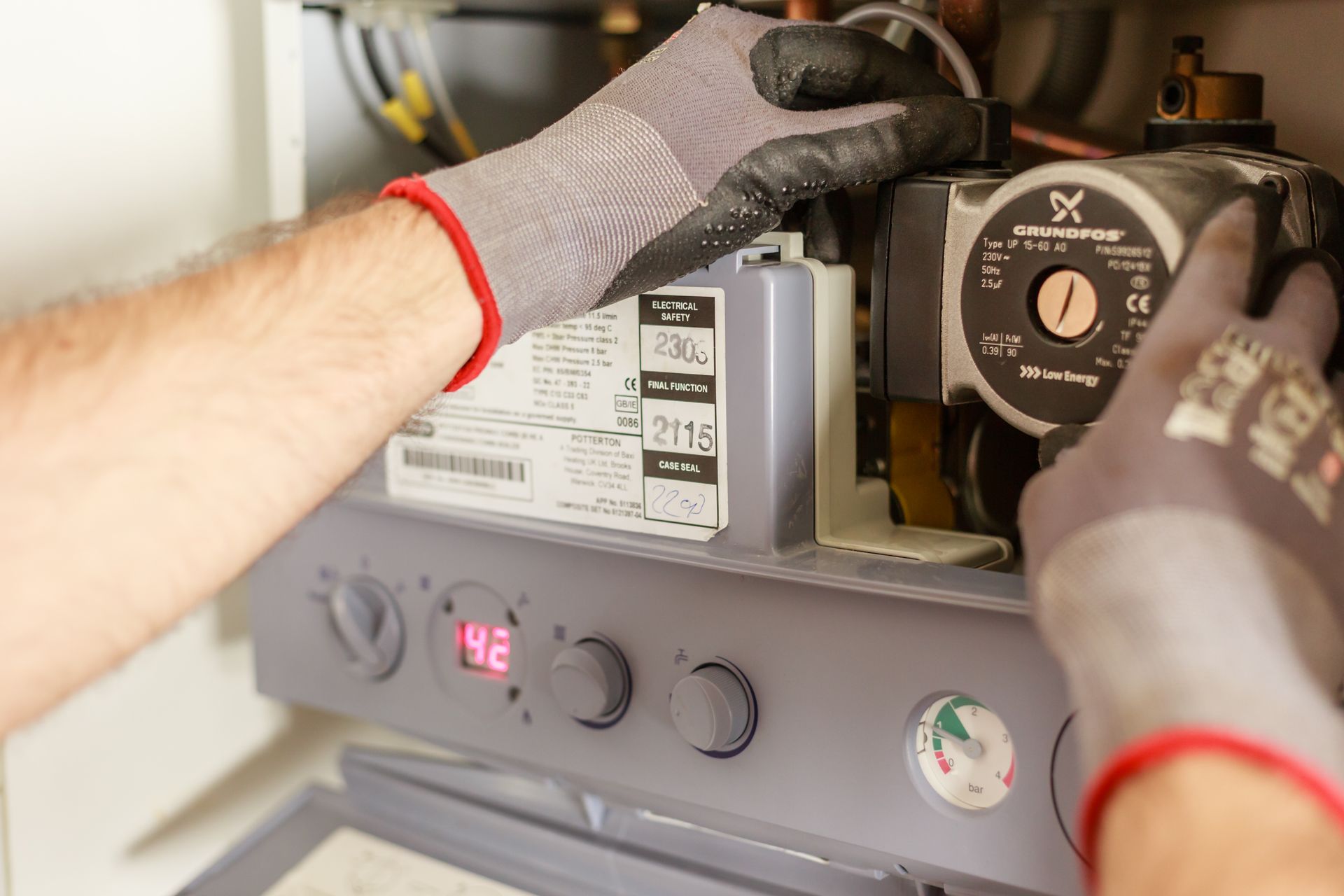 Technician servicing a tank water heater