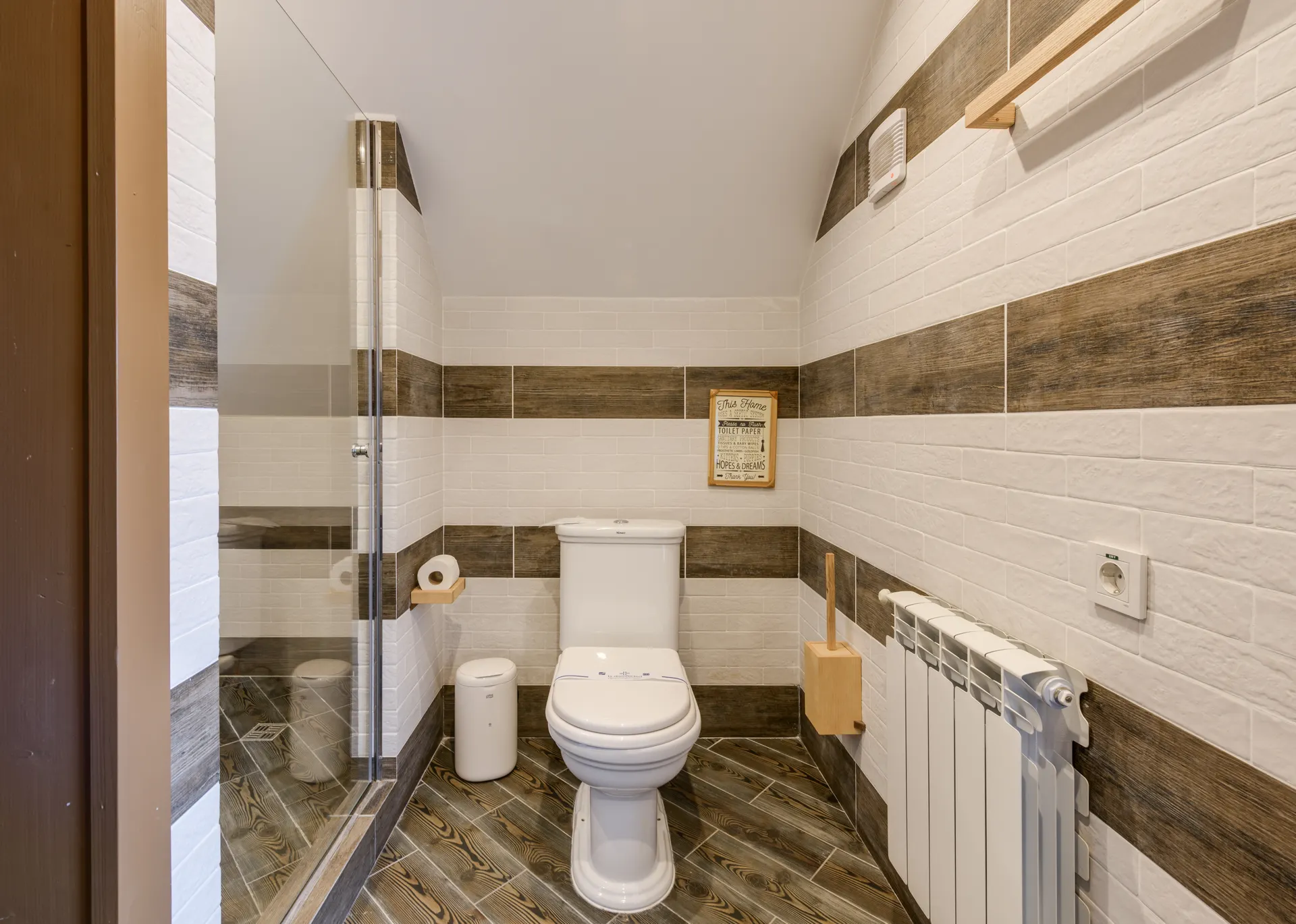 Modern bathroom interior with clean tile and new fixtures